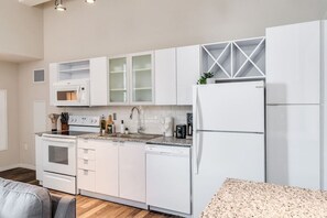 The kitchen invites you to experiment with new recipes, offering a stylish and practical space to cook and create.