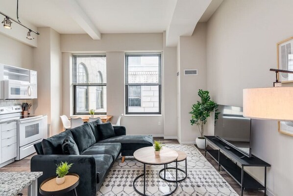As you take a seat in the living room, the comfortable furniture and tasteful design make it easy to unwind.