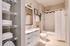You feel a sense of calm as you enter the bathroom, where the thoughtful design and high-quality materials create a serene environment.