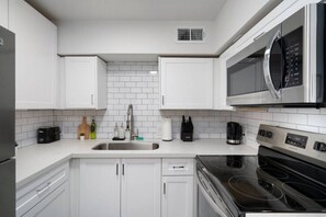 You can almost hear the sizzle of ingredients as you cook in the well-equipped kitchen, where every detail is designed for convenience.