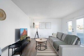 As you take a seat in the living room, the comfortable furniture and tasteful design make it easy to unwind.
