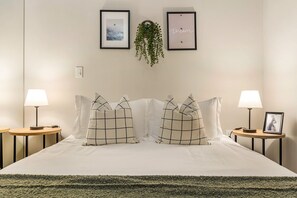 The bedroom offers a luxurious retreat, with a bed that promises restful nights and a room that feels like a private oasis.
