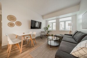 The dining room is bathed in natural light, creating a bright and inviting space where every meal feels special.