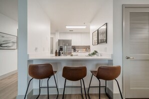 The dining area invites you to savor every moment, whether enjoying a quiet meal or hosting a festive gathering.
