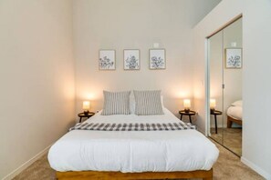 The bedroom offers a sanctuary of calm, where you can unwind and recharge in comfort and style.