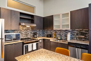 The kitchen invites you to experiment with new recipes, offering a stylish and practical space to cook and create.