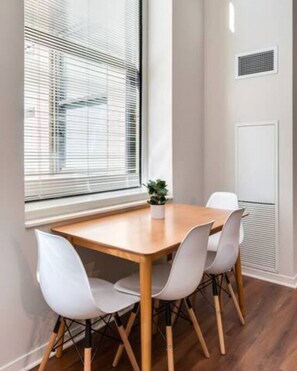 The spacious dining room invites you to savor every moment, whether enjoying a quiet meal or hosting a festive gathering.