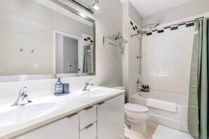 You feel a sense of calm as you enter the bathroom, where the thoughtful design and high-quality materials create a serene environment.