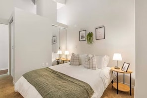 As you enter the bedroom, the sophisticated decor and plush bedding create a space where you can truly unwind.