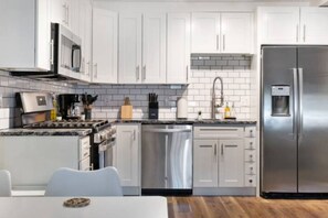 As you approach kitchen the elegant layout and well-stocked shelves make it the ideal spot to relax.
