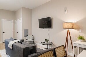 Relax in the living room and watch your favorite shows, lounging is a great way to unwind after a long day.
