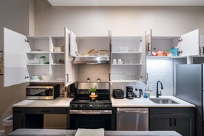 As you approach kitchen the elegant layout and well-stocked shelves make it the ideal spot to relax.