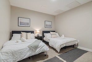 The bedroom offers a luxurious retreat, with a bed that promises restful nights and a room that feels like a private oasis.