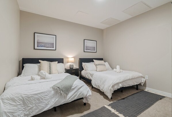 The bedroom offers a luxurious retreat, with a bed that promises restful nights and a room that feels like a private oasis.