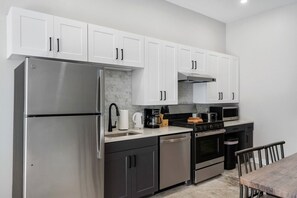 As you approach kitchen the elegant layout and well-stocked shelves make it the ideal spot to relax.