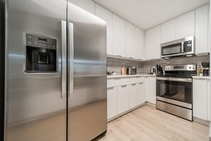 As you step into the kitchen, the clean lines and functional design make you eager to start cooking your favorite dishes.