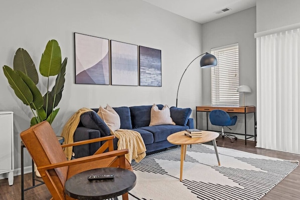 Spacious living room area with a dedicated work space