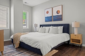 The king bedroom offers a luxurious retreat, with a bed that promises restful nights and a room that feels like a private oasis.
