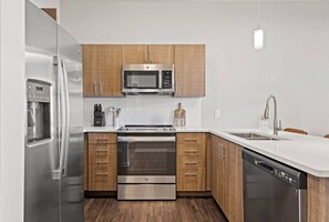 As you approach kitchen the elegant layout and well-stocked shelves make it the ideal spot to relax.