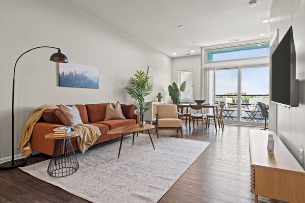Spacious living room with stylish decor, perfect for unwinding after a day of exploring the local area.