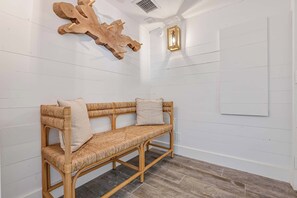 Beach chic entrance with bench and coat rack
