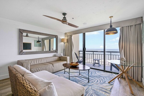 Living room with queen sleeper sofa with amazing sunrise and sunsets from your 15th floor covered balconies