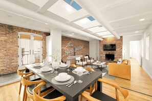 Elegant and welcoming, the dining area echoes the warmth and connection fostered by the Louise Hand Laundry’s storied past