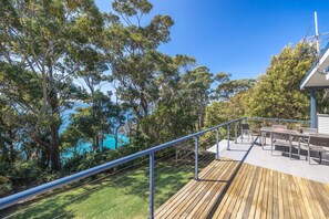 Large back deck overlooking stunning turquoise waters