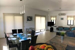 Dining area seating 7 guests.