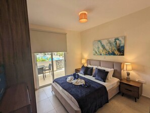masterbedroom with balcony access and tv