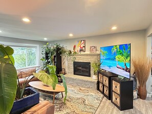 Living room with a 72” smart TV.
