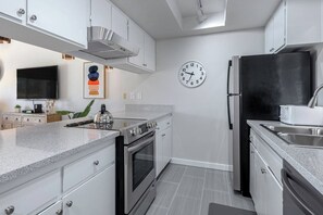 Updated kitchen with view into living room