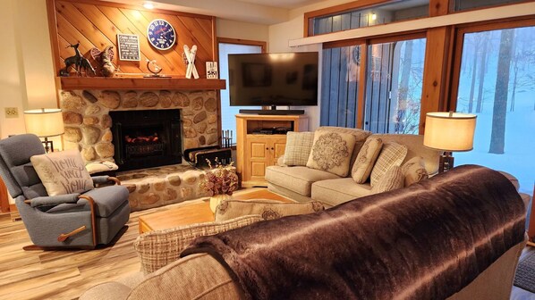 Cozy living room overlooking ski hills