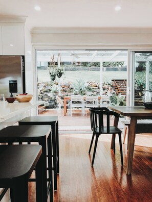 Open plan kitchen and dining, spilling out into large alfresco area with bbq.