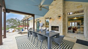 The patio offers incredible Hill Country views along with an outdoor dining table with seating for 8.