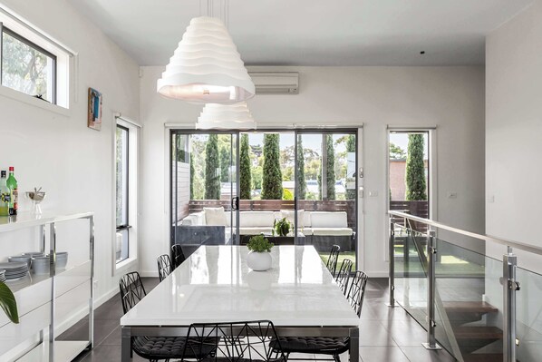 Enjoy breathtaking outlooks from the large 8-seater dining table, with direct flow to the sheltered deck