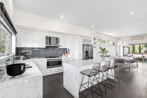 Beautifully renovated throughout, this home exudes a sleek, contemporary charm that guests will love