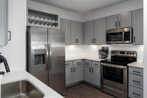 Fully stocked kitchen with high end stainless appliances
