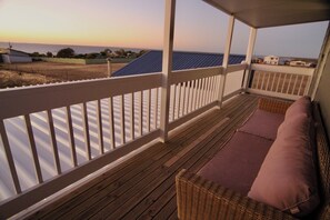 Features a luxurious master suite with a private balcony and ensuite.