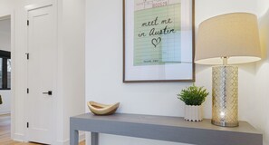 Warm welcomes start here—stylish touches and a nod to Austin charm greet you as you walk in.