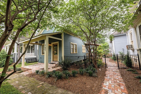 Enjoy your morning coffee on the porch swing as locals stroll by on 6th Avenue