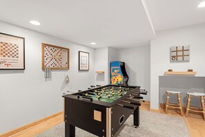 From foosball to throwback arcade games, this is where game night dreams come true.