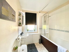 Master bathroom with shower over tub 