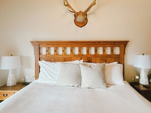 A king bed in a spacious room.