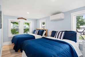 Relax in this well-appointed bedroom with a twin and two full beds, complete with a private bathroom for your exclusive use.
