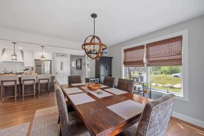 Enjoy meals and moments together in our inviting dining area, seamlessly connected to the chef's kitchen.