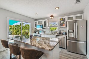 Sip morning coffee or grab a bite at the kitchen counter, with space for 3