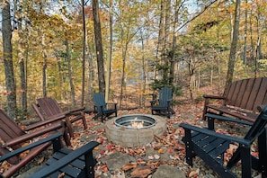 The fire pit area features plenty of seating for all family and friends