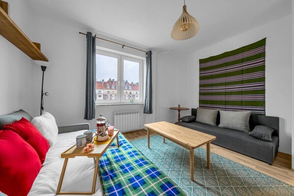 Studio - Living area with Queen Bed and Smart TV | Book Now with RENTUJEMY.COM