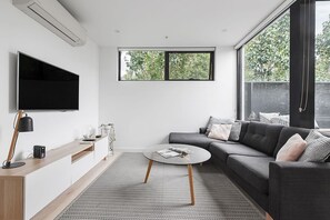 Enjoy relaxed evenings at home thanks to a large wall-mounted TV and free Wi-Fi throughout the apartment, catering to all your entertainment needs.
